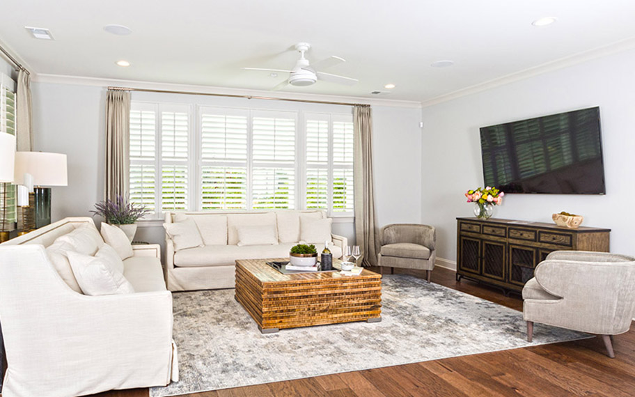 White polywood shutters in a large white living room
