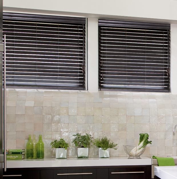 Wood blinds above a kitchen sink