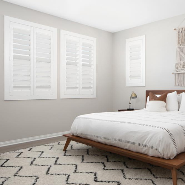 White Plantation Shutters in a bedroom