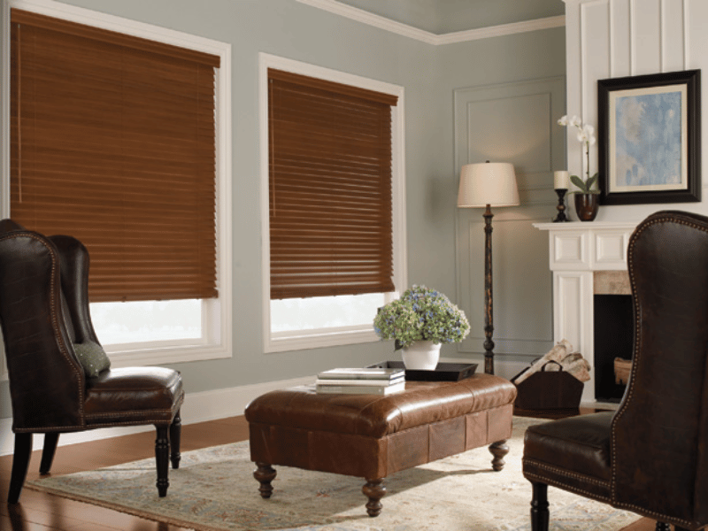 Brown wood blinds on living room windows