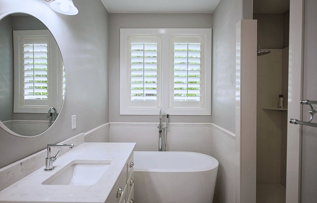 White moisture-resistant polywood shutters in a bathroom