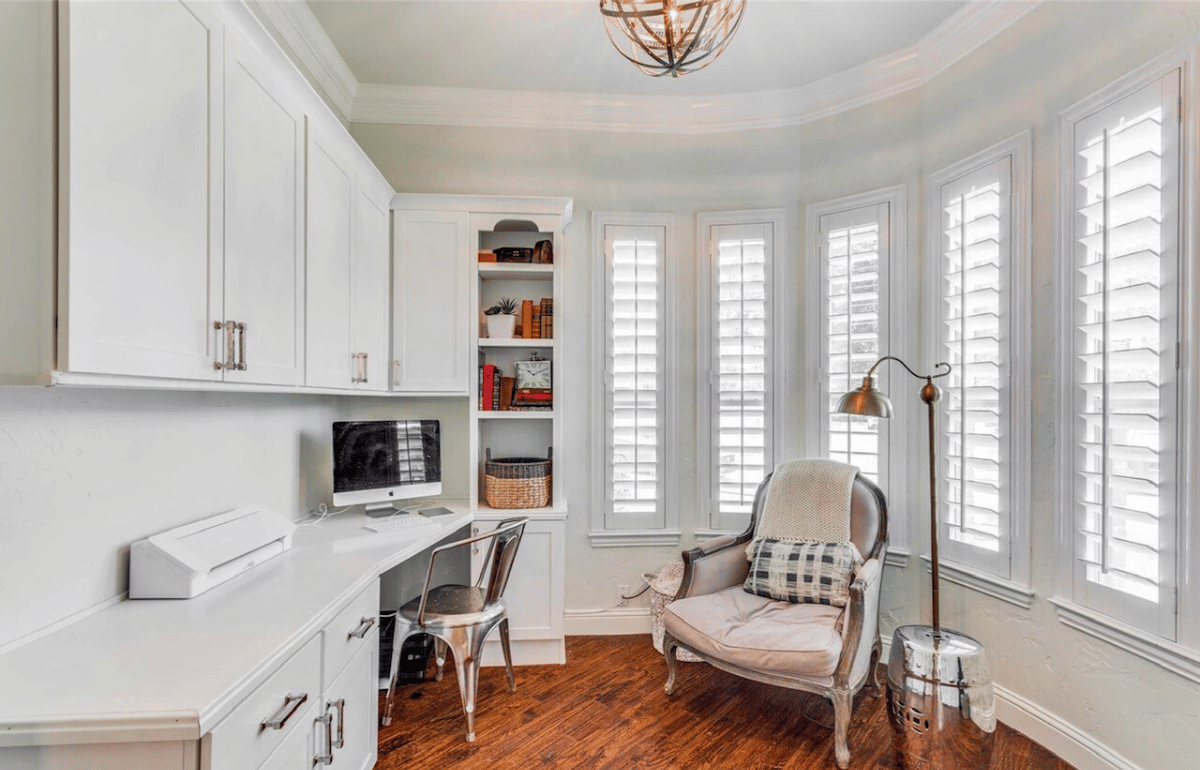 White polywood shutters in an ivory home office