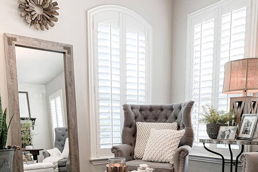 Polywood shutters on corner windows in an elegant living room