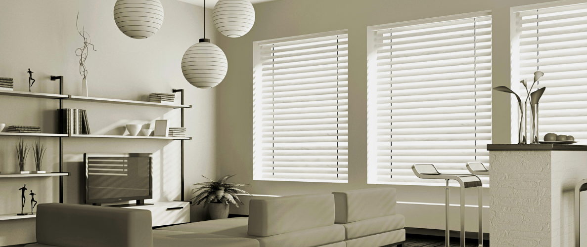 Bright white window blinds on windows in a white living room