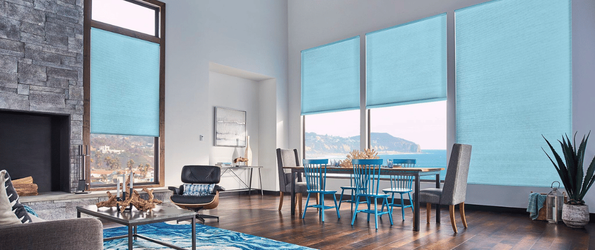 Light blue window shades on large living room windows