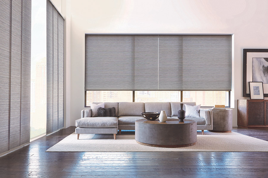 Gray window shades on large living room windows