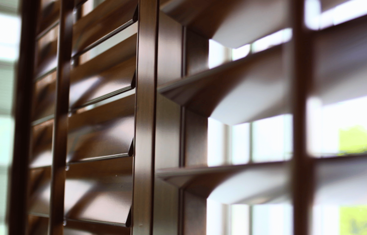 Closeup of brown faux wood blinds slats.