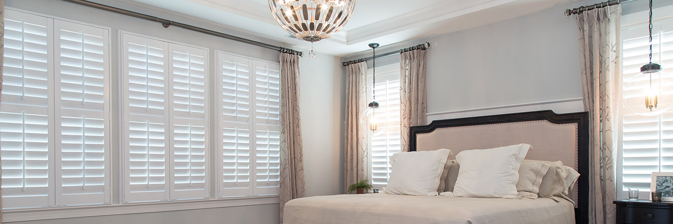 White Polywood shutters on bedroom windows