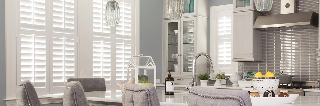 White plantation shutters in a stylish kitchen