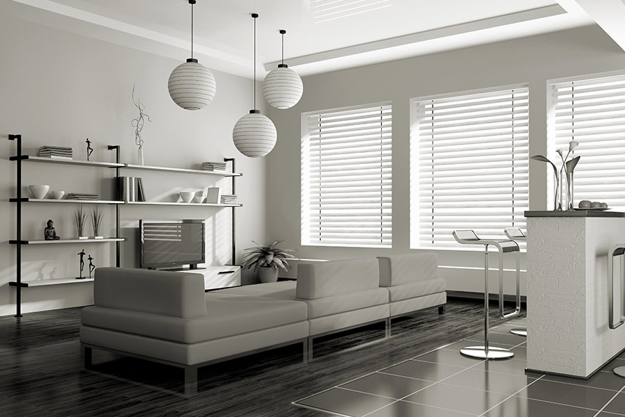 White blinds on windows in a white living room