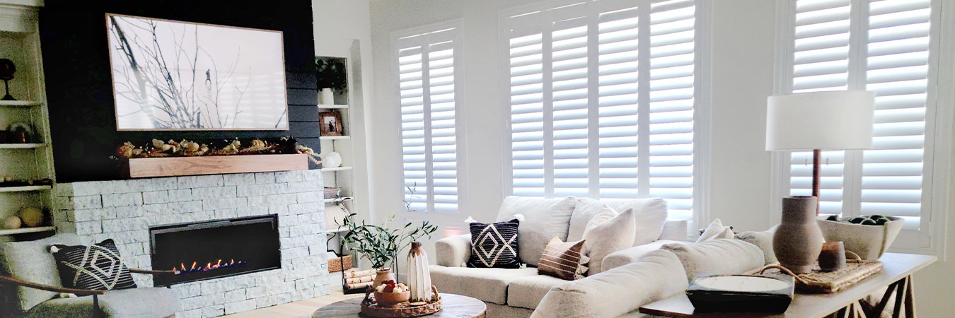 Polywood shutters on windows in a cozy living room