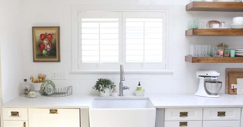White Cottage Home kitchen with interior shutters
