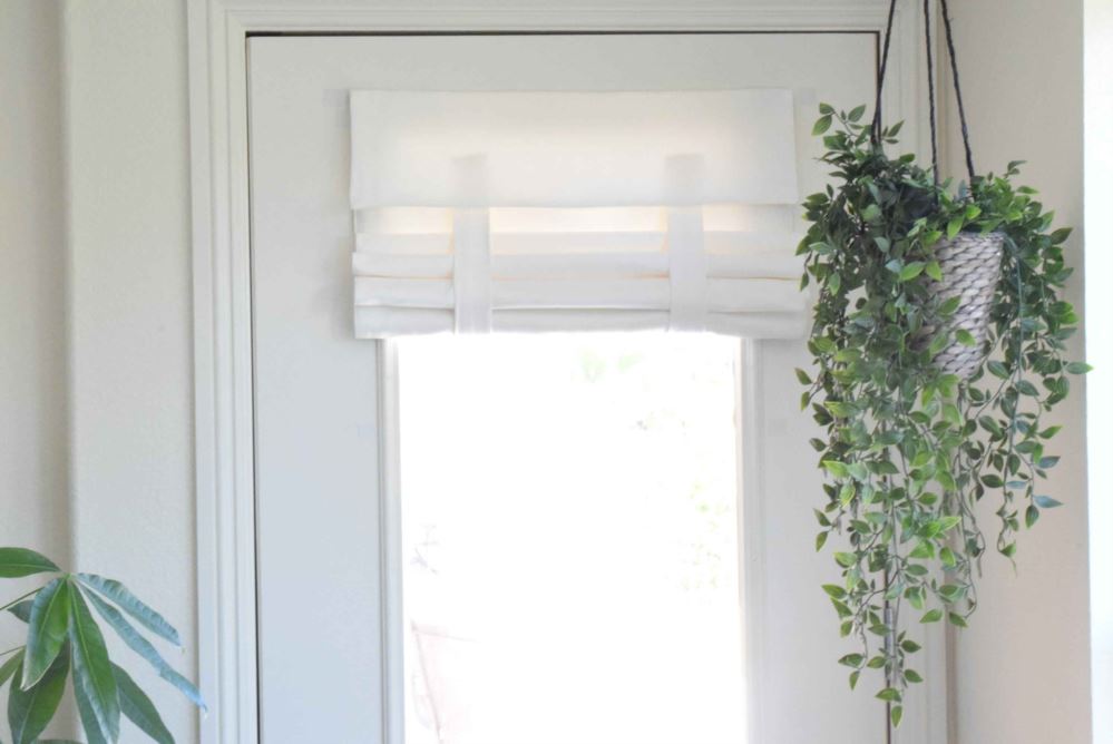 White herringbone shade rolled up