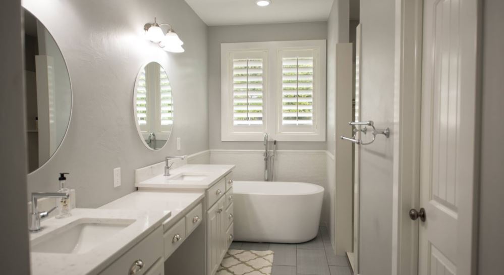 Photo Credit: Room Resolutions Plantation shutters in a bathroom