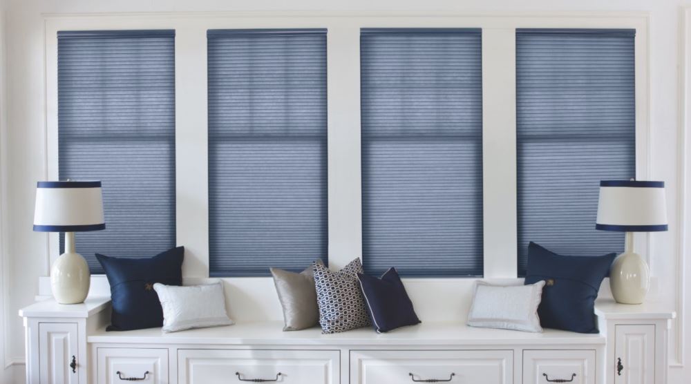 Cellular shades are a stylish option to cover shallow windows. Blue cell shades