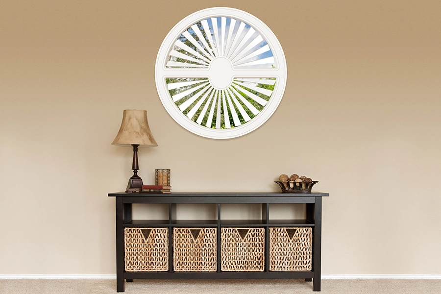 You don't have to hide a circle window behind a square treatment when you can have interior shutters! White Polywood shutter on a circle window