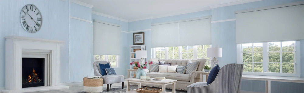 Light gray roller shades in a baby blue beach theme living room area