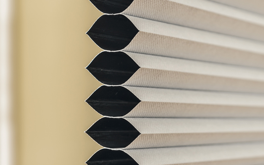 Skylight cellular window shades conserve energy in your home. Up close shot of cellular shades.